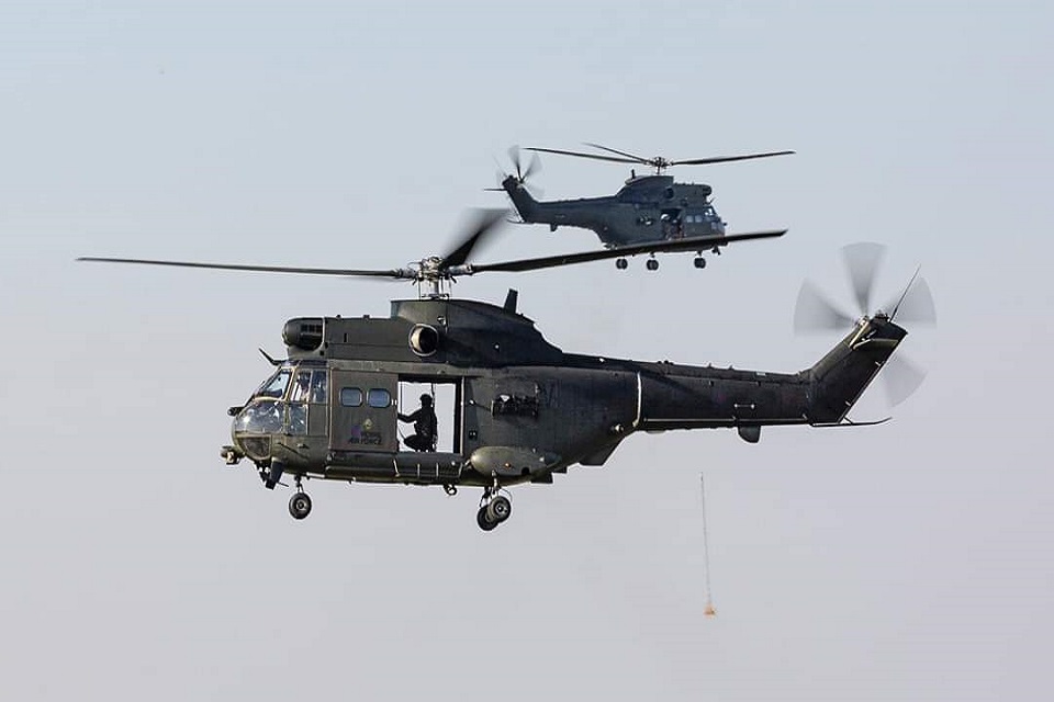 Picture shows 2 RAF Puma in the sky on route to return to their home in Oxfordshire.