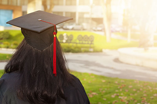 Rear view of a college graduate
